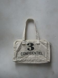 White Confidentiel Title Hand Bag